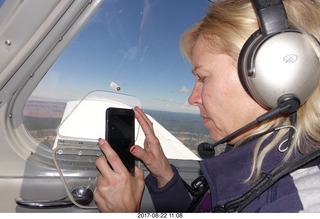 55 9sn. Kim taking a picture at the grand canyon