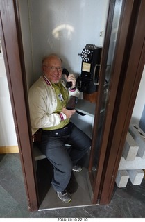 Bell Telephone museum tour with Don Barnickel - Adam in telephone booth calling cell phone
