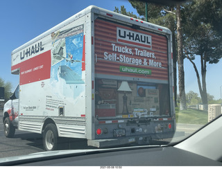 U-Haul truck with picture of half-open door on closed door