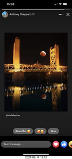 lunar eclipse over bridge