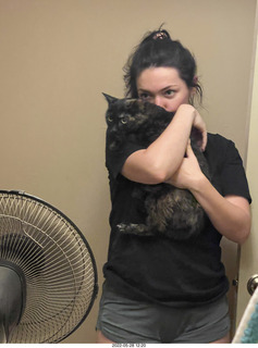 door open with cat Miss Pris in the bathroom with Olga