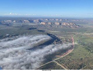 aerial - flight to Mystic Bluffs - fog in the valleys