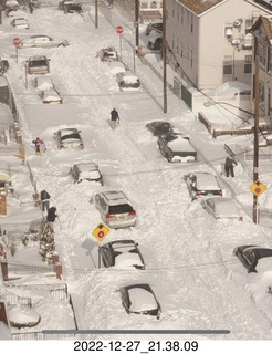 Facebook - snow covered street and cars