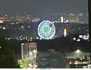 195 a24. Mexico City at night - cool ferris wheel in the distance