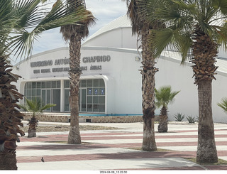 97 a24. Torreon eclipse day - campus building and trees