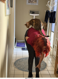 Ashley Saenz and cat Pickle on her back