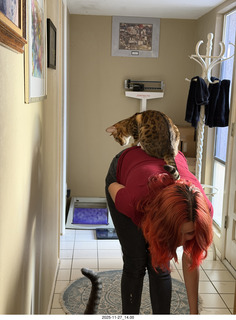 Ashley Saenz and cat Pickle on her back