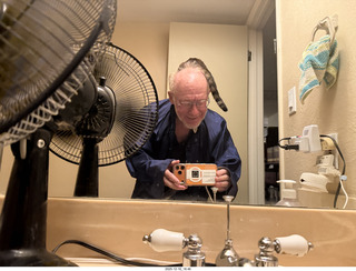 cat Pickle on my coat rack
