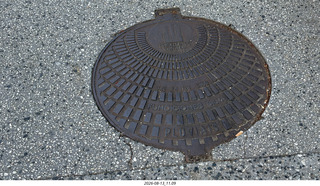 197 a2y. Spain - Santiago de Compostela - walking tour - seashell manhole cover