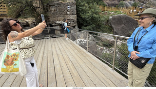 85 a2y. Spain - bus tour of north shore - river - people taking pictures of people