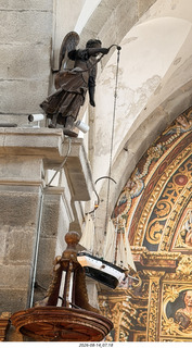 212 a2y. Spain - bus tour of north shore - church - hanging boat